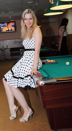 Pretty blonde Ukrainian girl on pool table